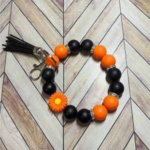 Orange and Black Floral Wristlet